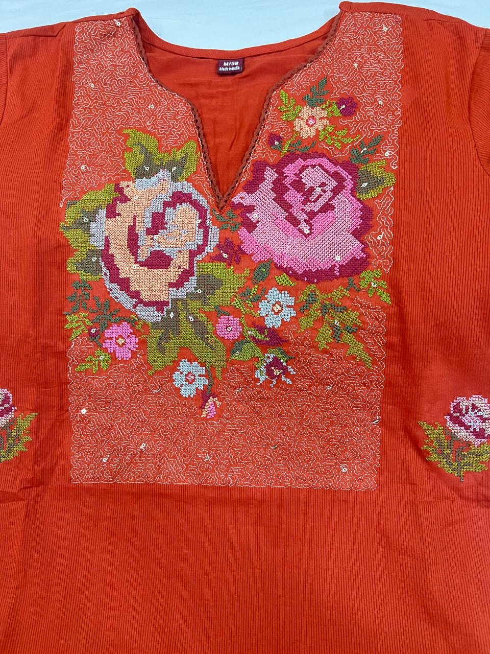 Soft cotton fabric texture of Rust Orange embroidered kurta set for women