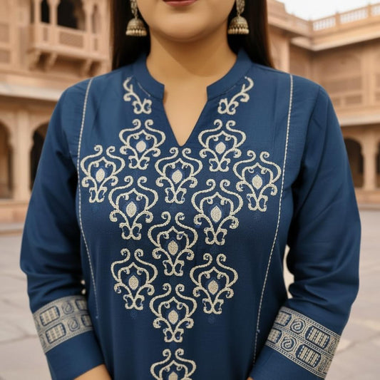 Woman wearing a blue embroidered traditional outfit